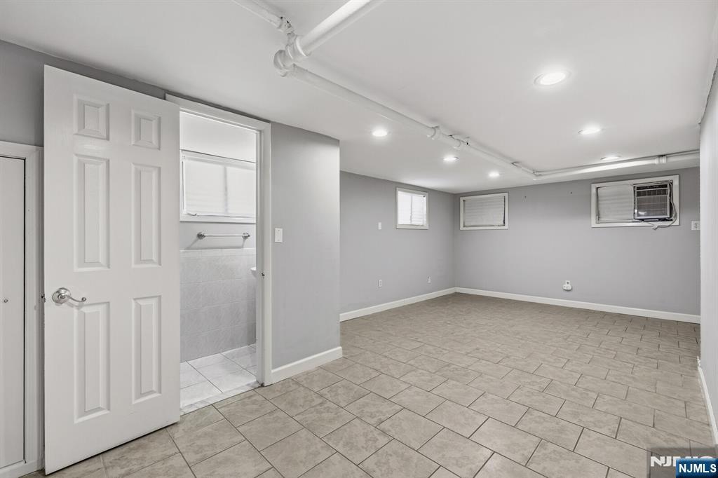 346 Carmita Avenue Rutherford, NJ 07070 - Photo 32 of 47 an empty room with a empty space and windows