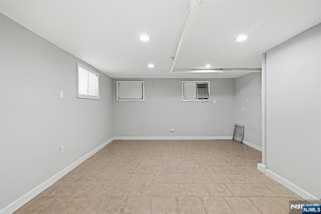346 Carmita Avenue Rutherford, NJ 07070 - Photo 34 of 47 an empty room with a empty space and windows