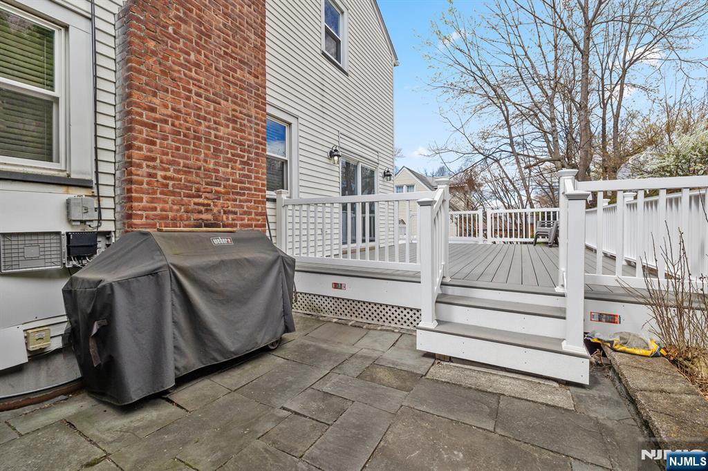 346 Carmita Avenue Rutherford, NJ 07070 - Photo 38 of 47 a view of a house with a large window and wooden fence