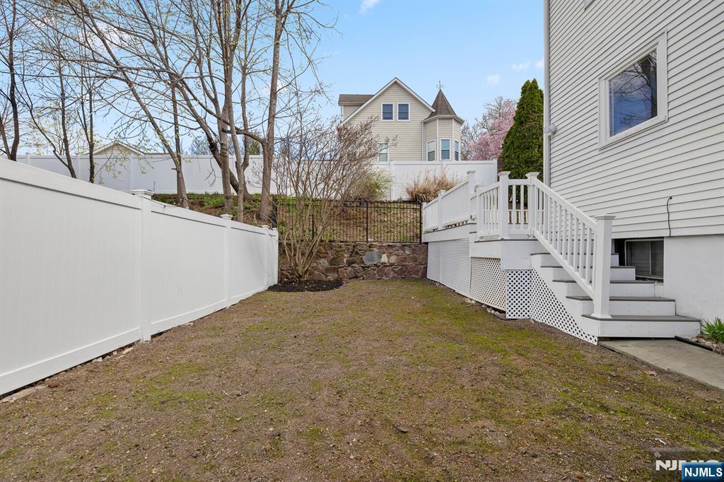 346 Carmita Avenue Rutherford, NJ 07070 - Photo 39 of 47 a view of a house with a yard and garage