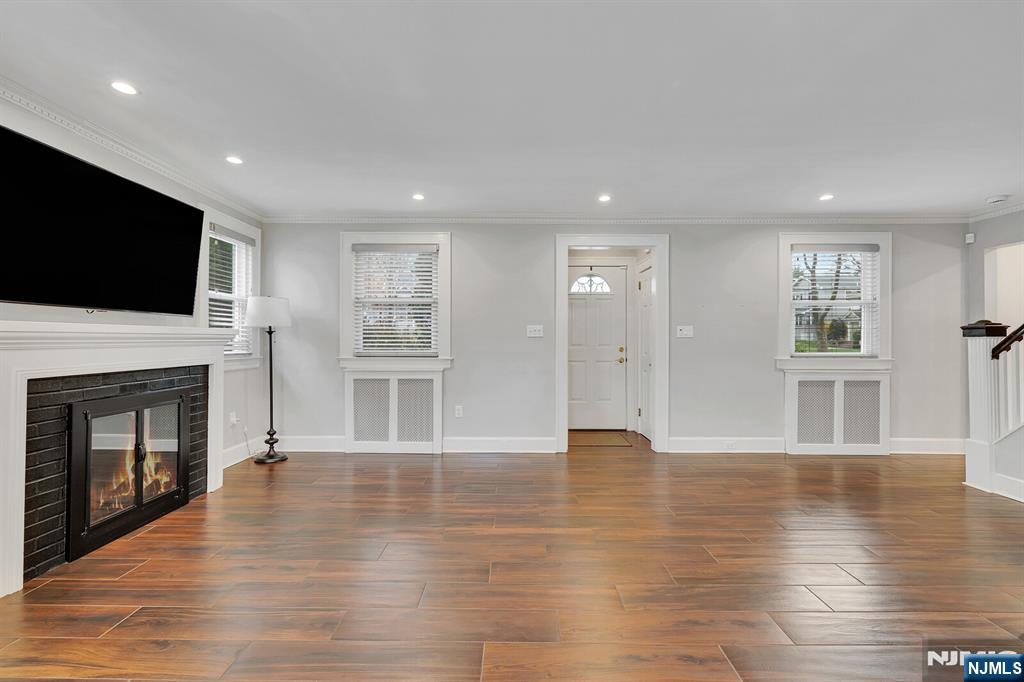 346 Carmita Avenue Rutherford, NJ 07070 - Photo 7 of 47 a view of an empty room with wooden floor and a window
