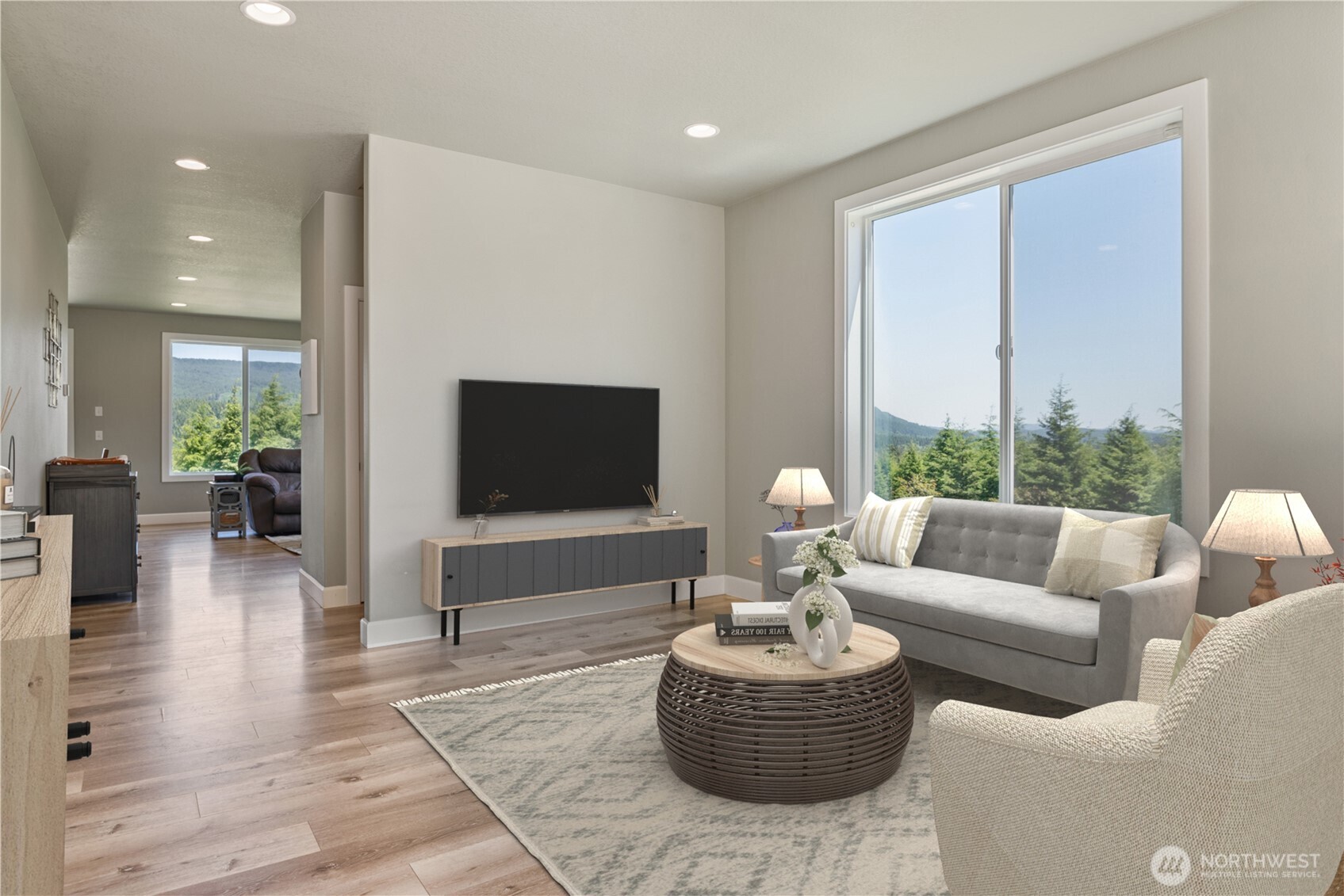 327 Parpala Road Naselle, WA 98638 - Photo 2 of 39 a living room with furniture a large window and a flat screen tv
