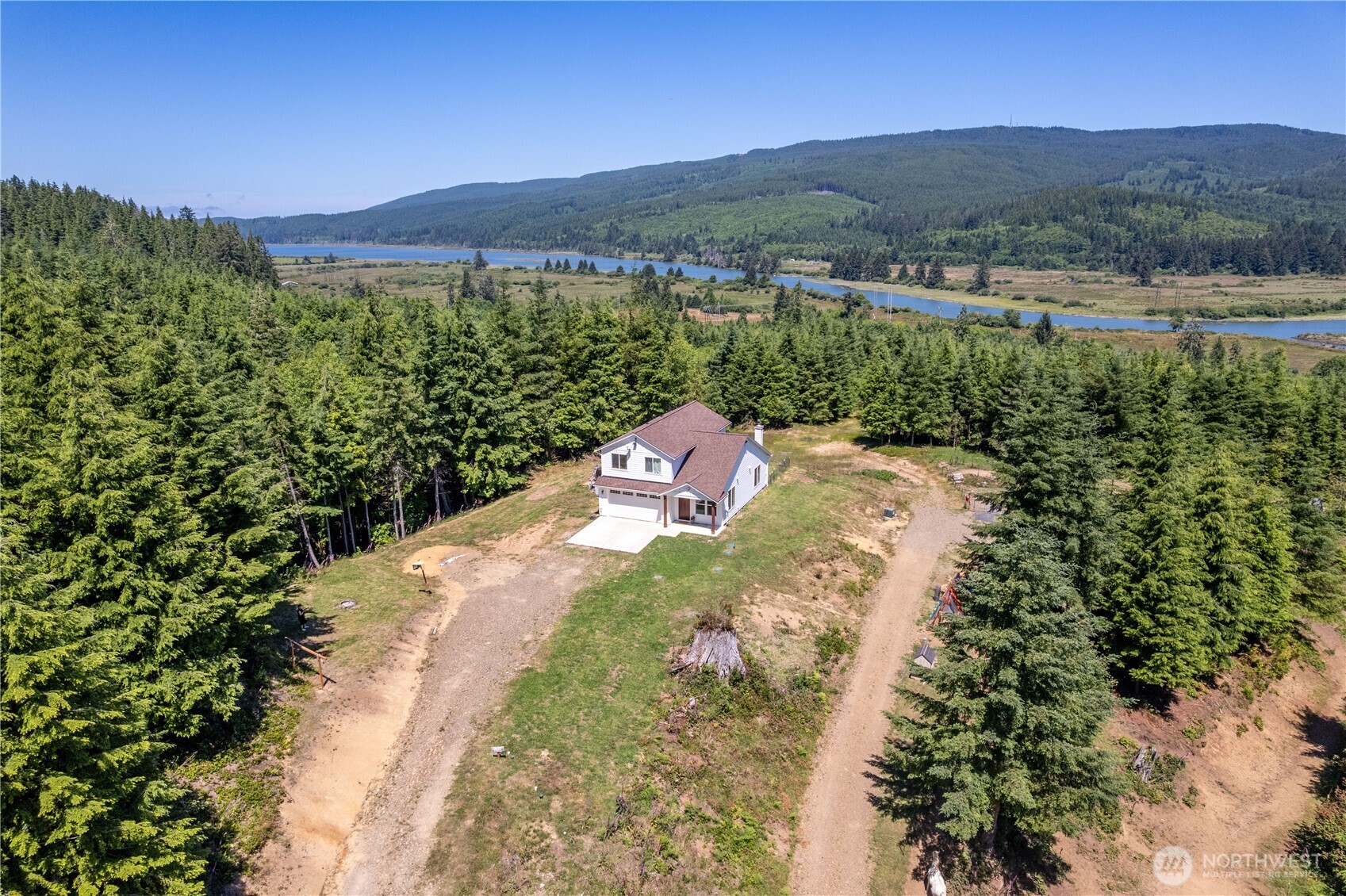 327 Parpala Road Naselle, WA 98638 - Photo 38 of 39 a view of a lush green hillside and houses