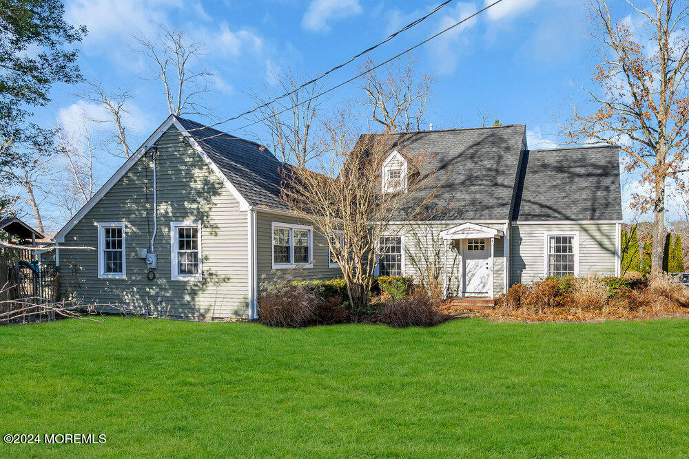 1 Cooper Drive Howell, NJ 07731 - Photo 3 of 40 a front view of a house with garden