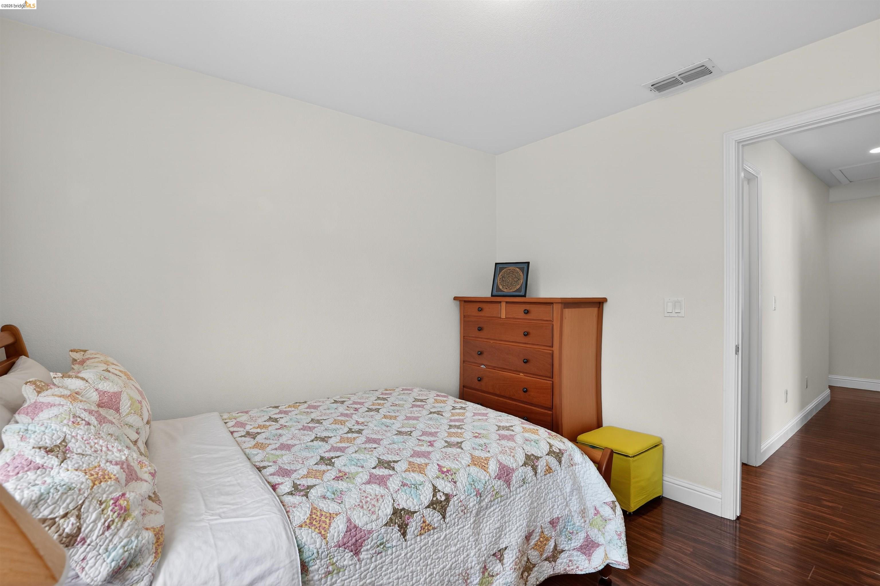 1221 Andrea Way Vallejo, CA 94591 - Photo 21 of 29 Bedroom featuring light-toned walls, dark wood-finish flooring, and white baseboards