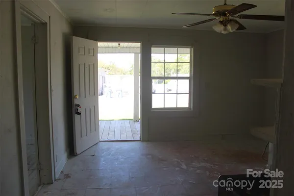 a view of an empty room with a window