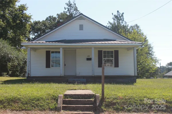 a house with trees in the background