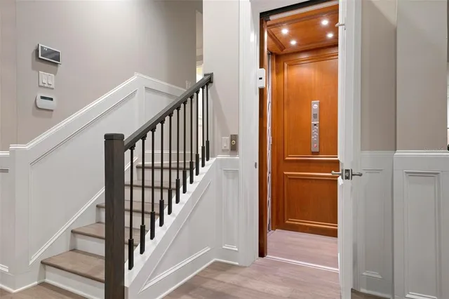 a bedroom with a large bed and a large window