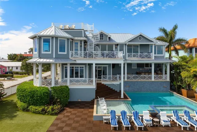 a living room with furniture ceiling fan and a rug