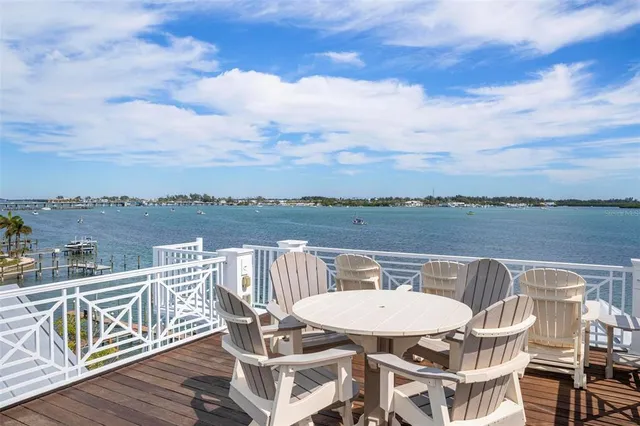 a large kitchen with a table and chairs
