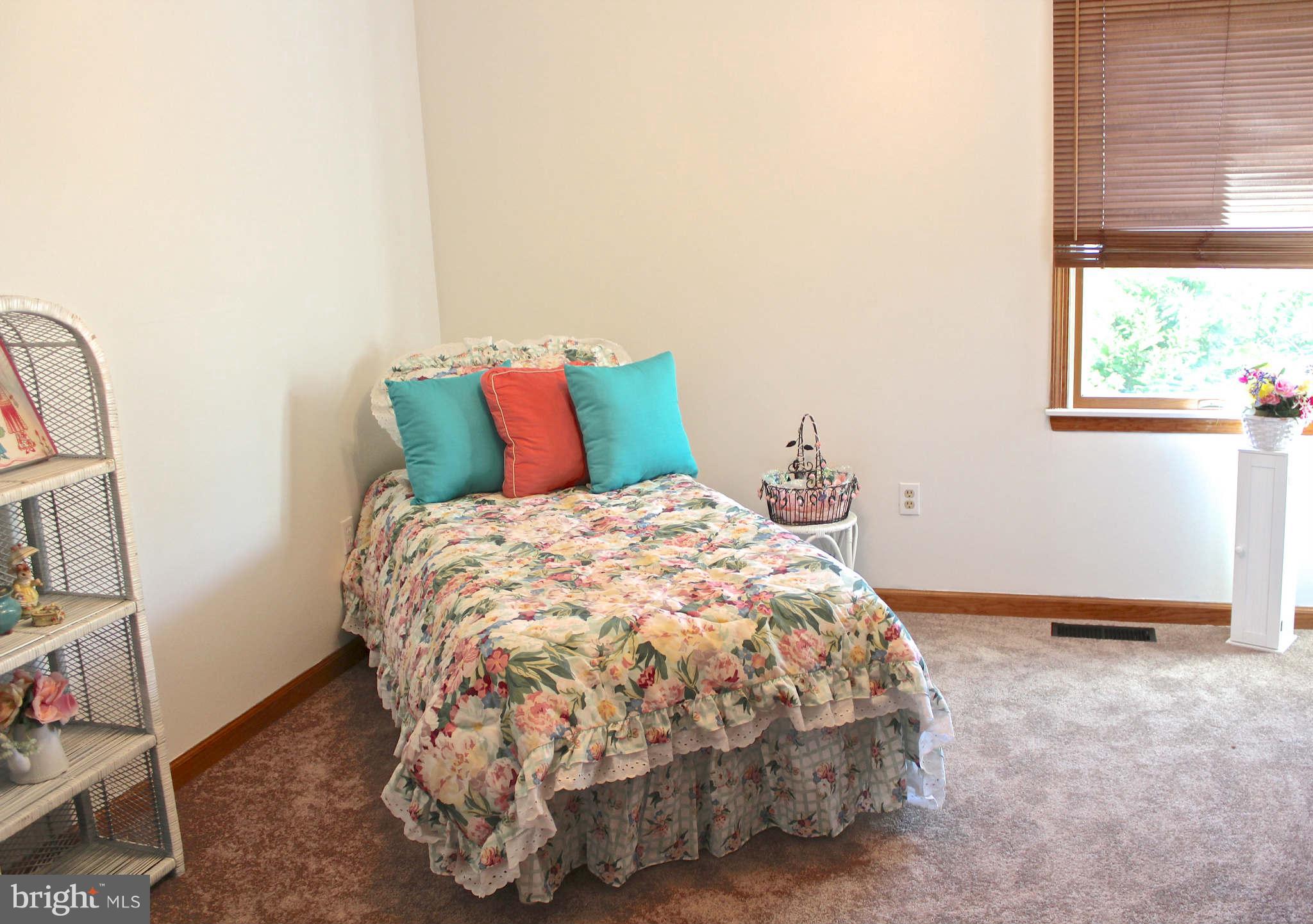 3697 Altondale Road Reisterstown, MD 21136 - Photo 14 of 21 a bed sitting in a bedroom next to a window