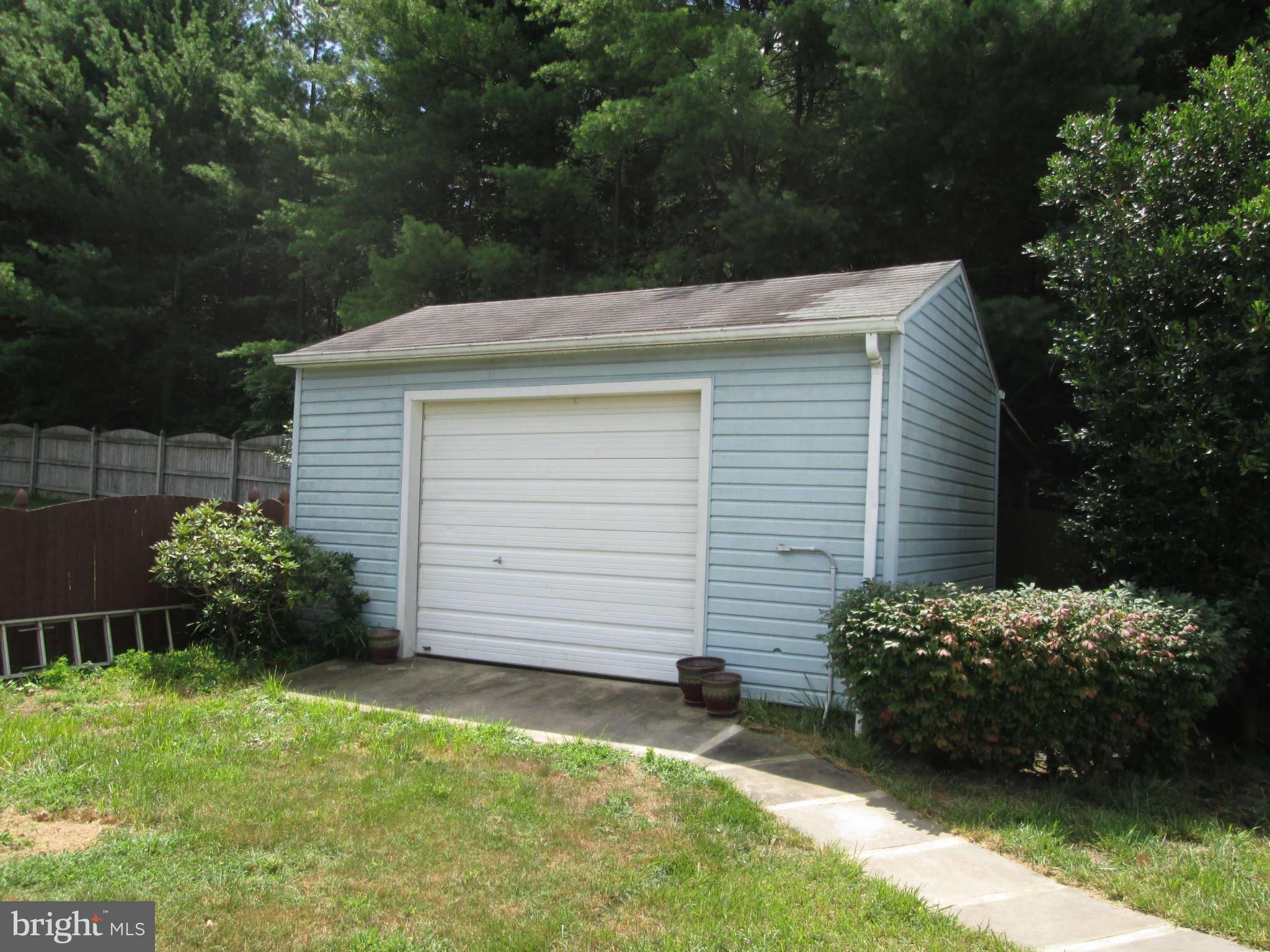 3697 Altondale Road Reisterstown, MD 21136 - Photo 20 of 21 a view of backyard with potted plants and a tree