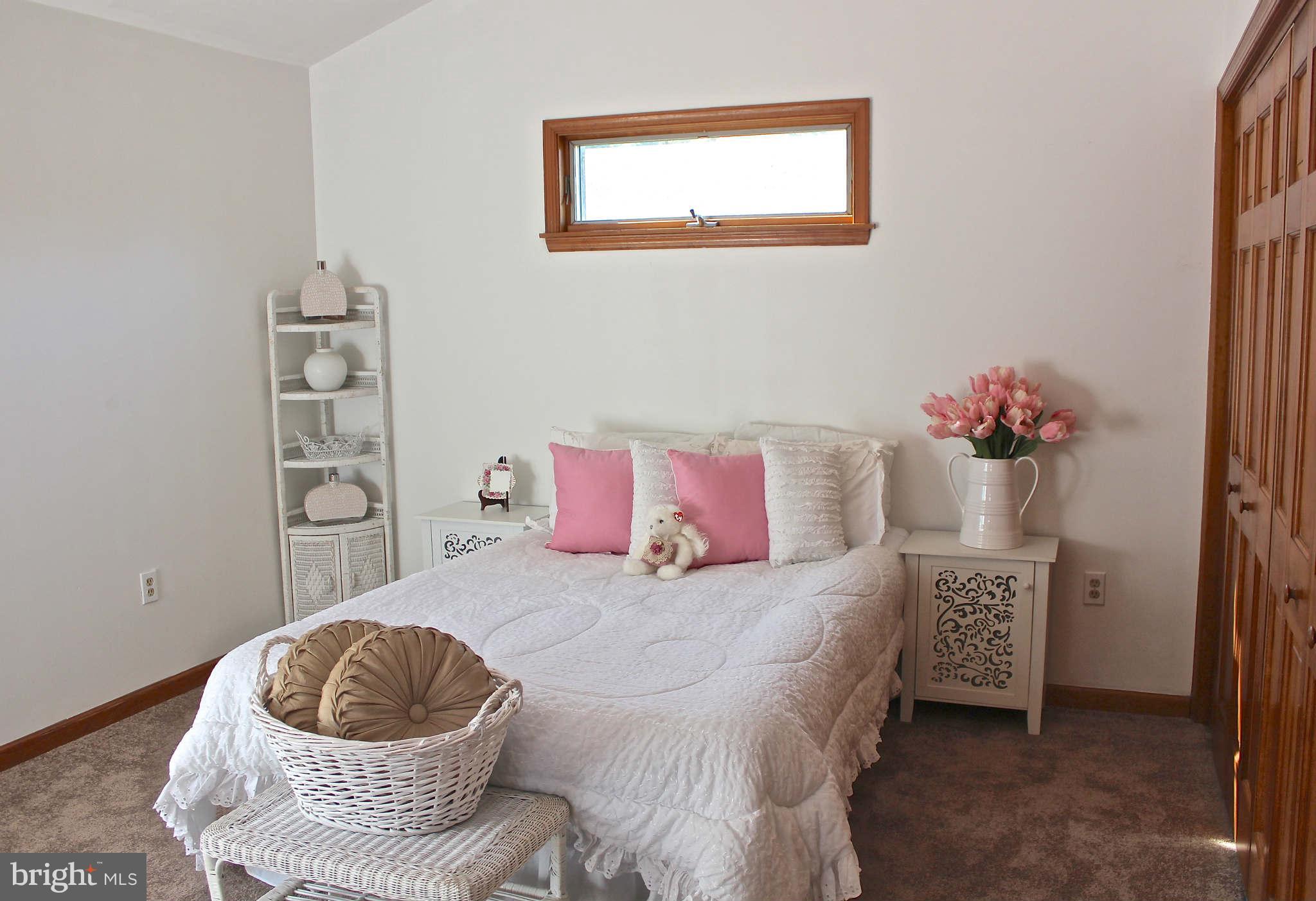 3697 Altondale Road Reisterstown, MD 21136 - Photo 8 of 21 a bedroom with a bed and a window