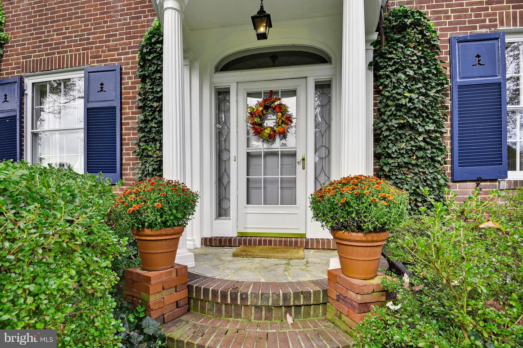 708 Stoneleigh Road Baltimore, MD 21212 - Photo 2 of 61 a view of a house with sitting area and potted plants