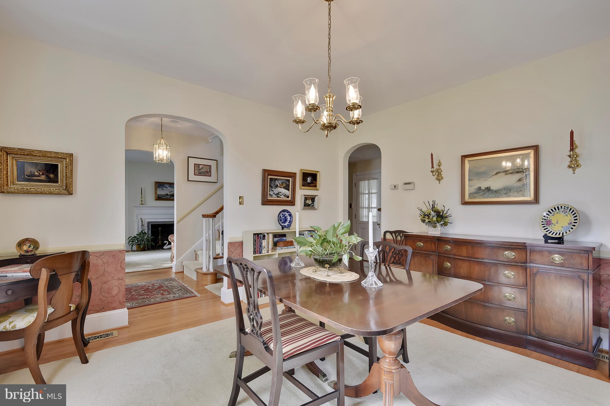 708 Stoneleigh Road Baltimore, MD 21212 - Photo 12 of 61 a view of a dining room with furniture and chandelier
