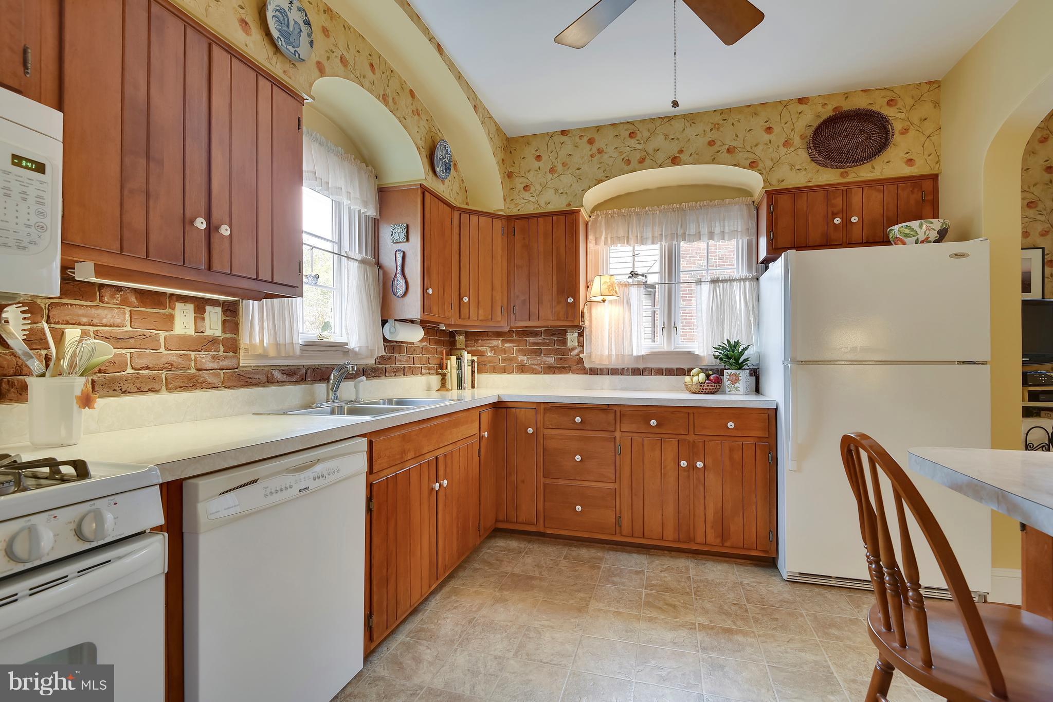 708 Stoneleigh Road Baltimore, MD 21212 - Photo 22 of 61 a kitchen with stainless steel appliances granite countertop a refrigerator a sink a stove and a cabinets
