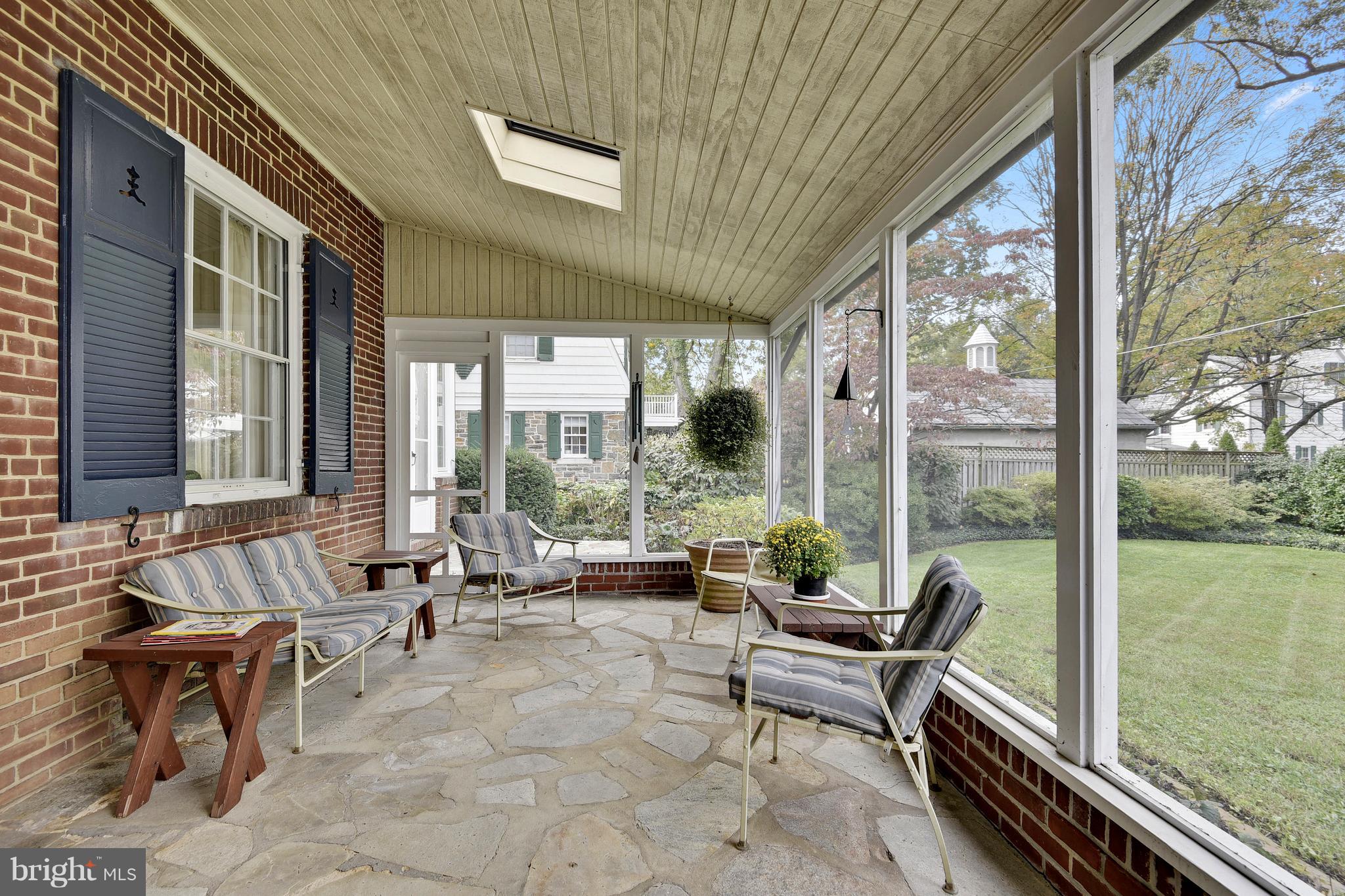 708 Stoneleigh Road Baltimore, MD 21212 - Photo 33 of 61 a living room with furniture and floor to ceiling windows