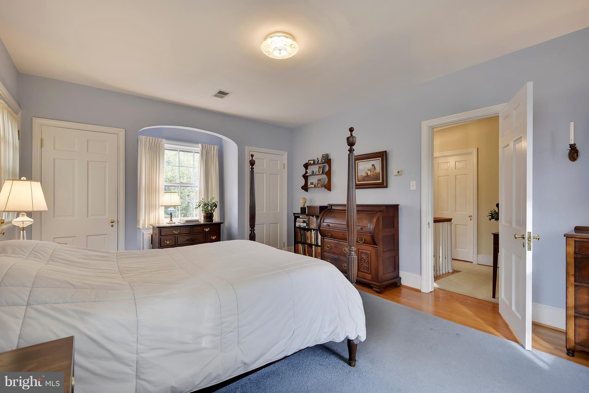 708 Stoneleigh Road Baltimore, MD 21212 - Photo 39 of 61 a spacious bedroom with a bed and a dresser in it