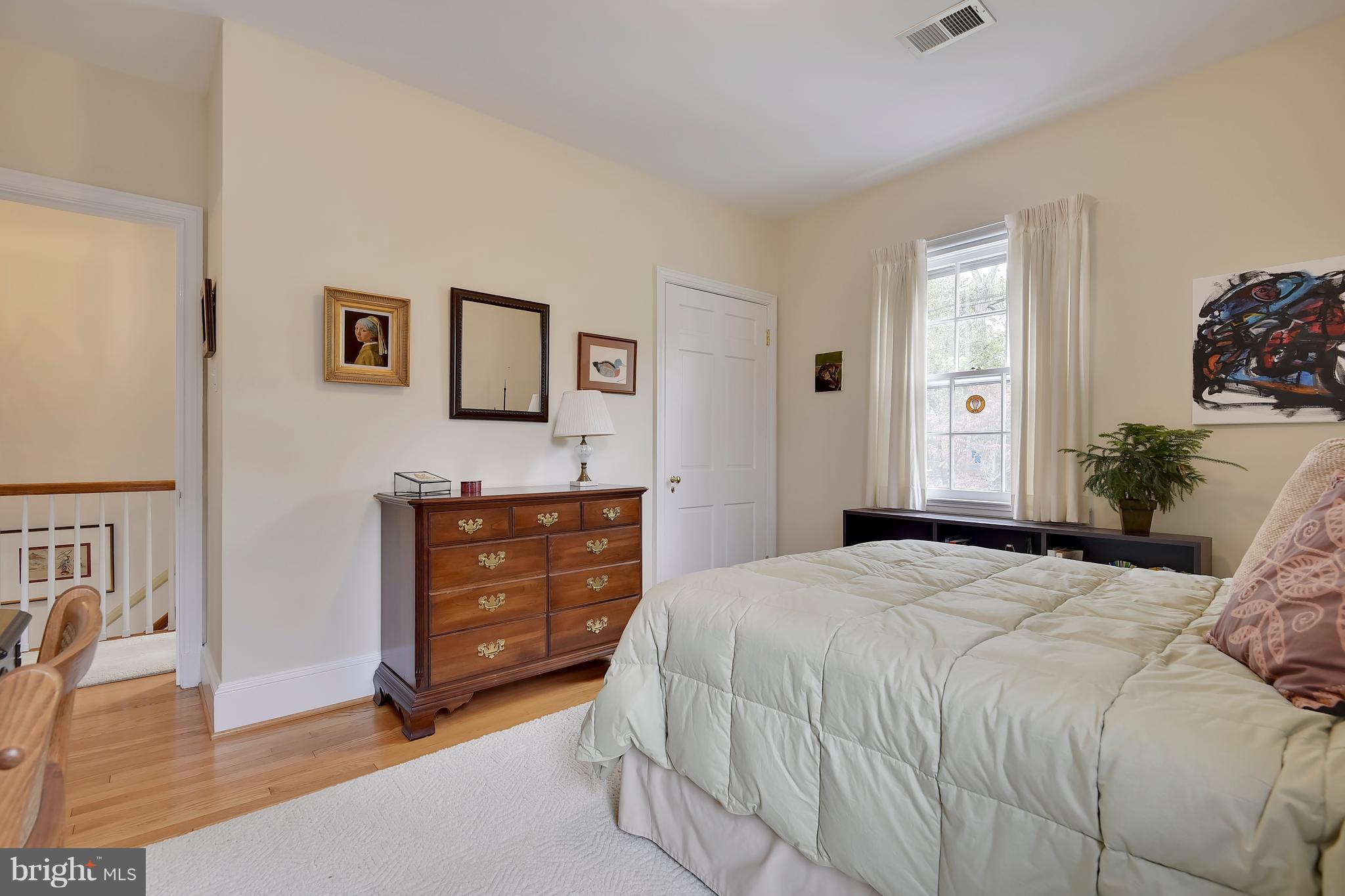 708 Stoneleigh Road Baltimore, MD 21212 - Photo 43 of 61 a bedroom with a bed and a dresser