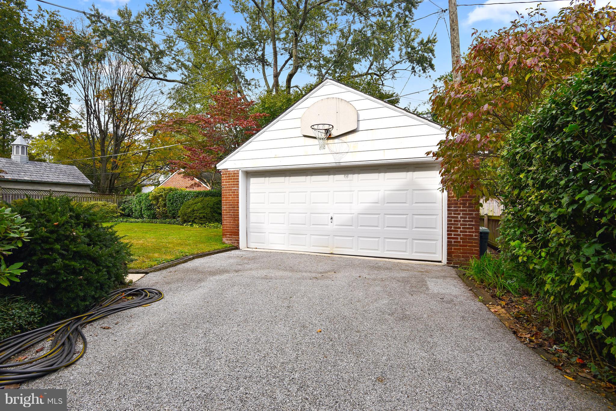 708 Stoneleigh Road Baltimore, MD 21212 - Photo 52 of 61 a view of a house with a yard and garage