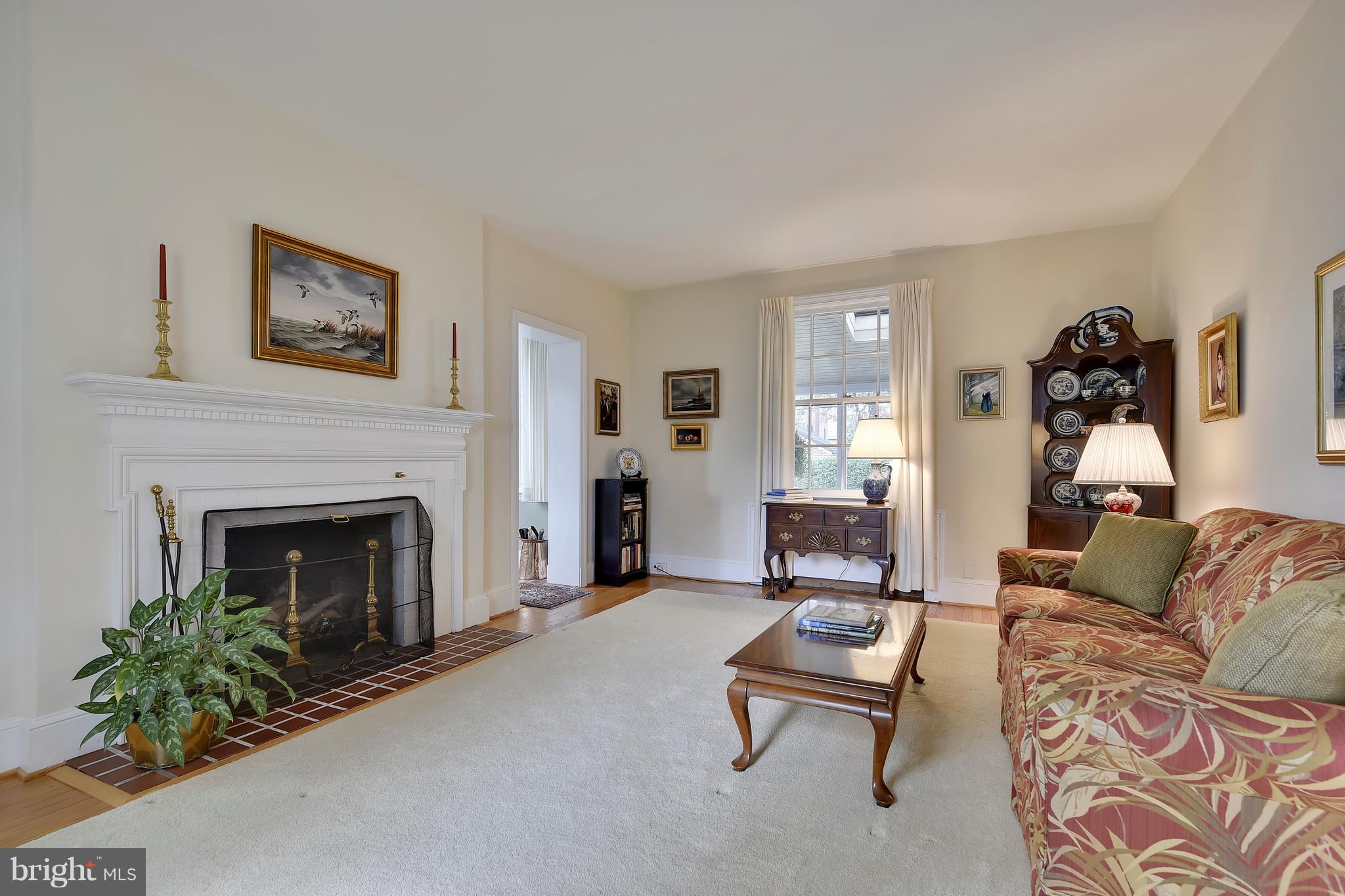 708 Stoneleigh Road Baltimore, MD 21212 - Photo 8 of 61 a living room with furniture and a fireplace