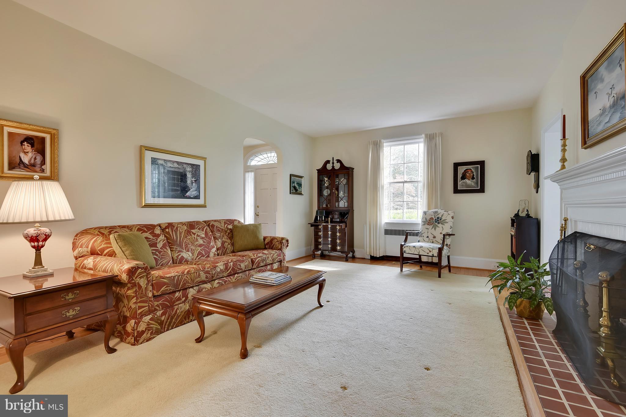 708 Stoneleigh Road Baltimore, MD 21212 - Photo 10 of 61 a living room with furniture and a fireplace