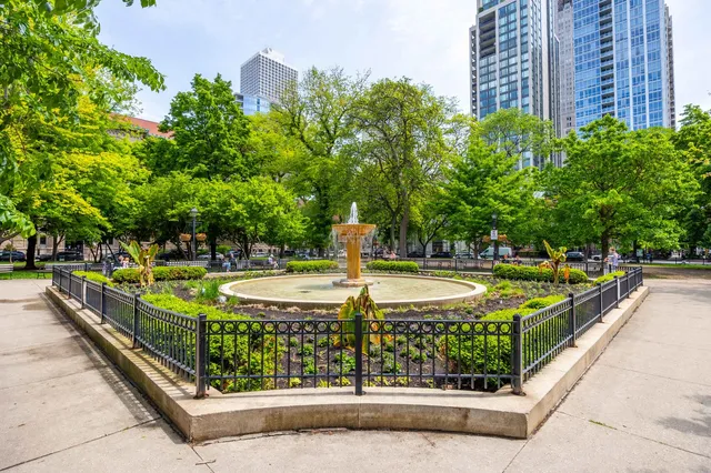 a view of a water fountain in front of a building