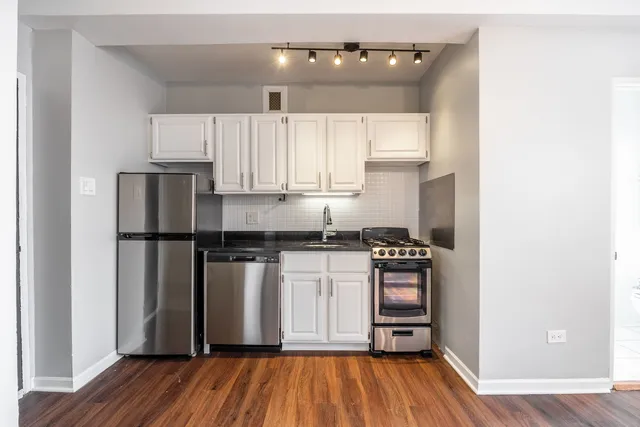 a view of a dinning tables and chairs in the roof deck