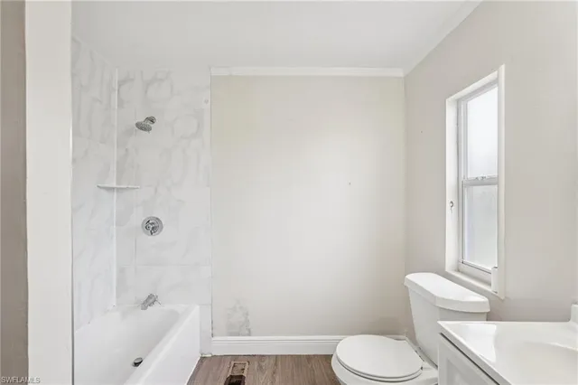 a bathroom with a toilet and shower