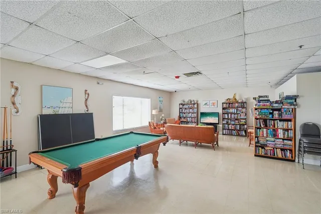 a room with furniture and gym equipment