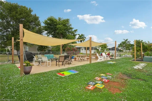 a view of a patio with a table and chairs