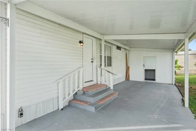 a view of a hallway with staircase
