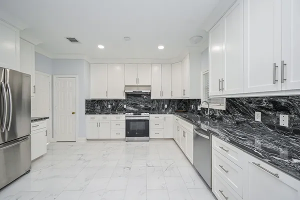 a living room with furniture fireplace and rug