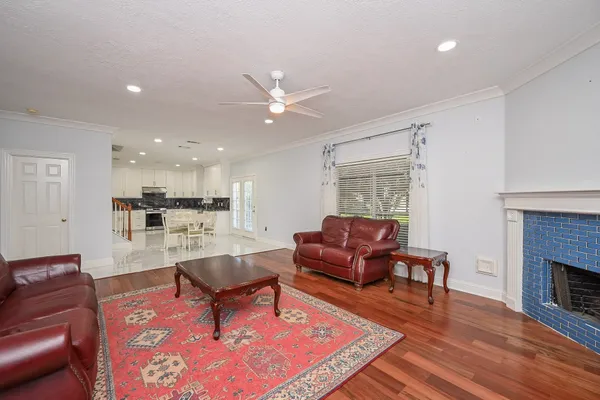 a bathroom with a granite countertop sink and a bathtub