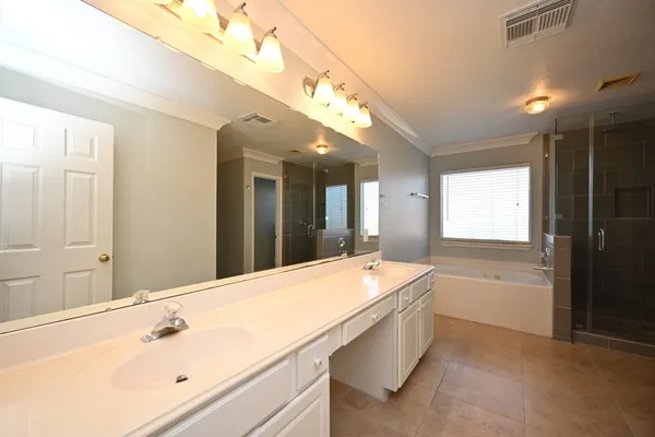 a view of a patio with table and chairs and potted plants