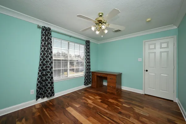 a view of a house with pool and chairs