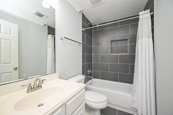 a wooden bench sitting in the middle of a park