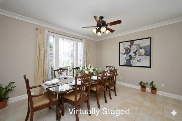 a view of a dining room that has a table and chairs