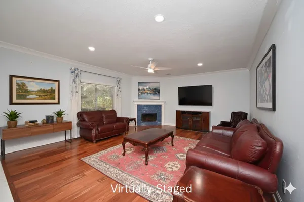 a bedroom with a large bed and a flat screen tv