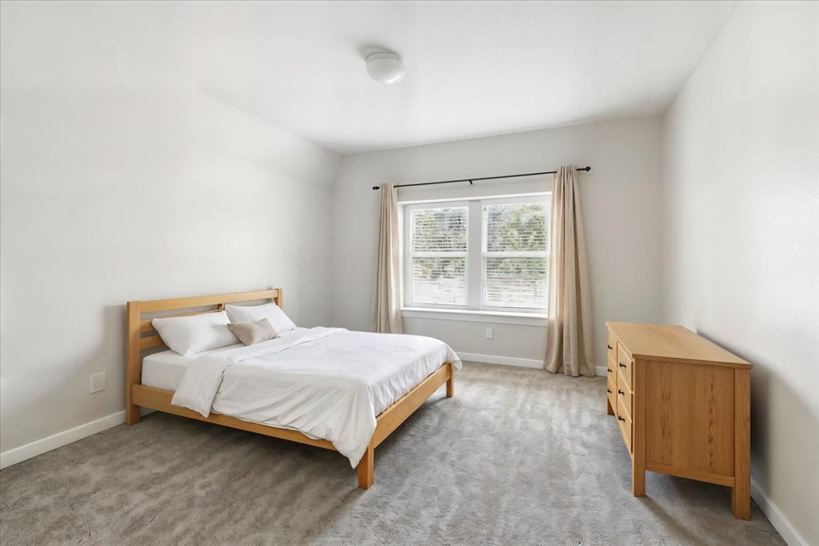 305 Old Trinity Way Georgetown, TX 78628 - Photo 12 of 23 a bedroom with a bed and a window