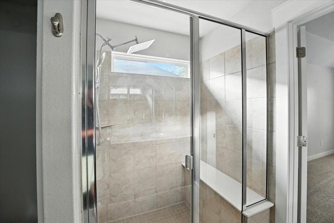 305 Old Trinity Way Georgetown, TX 78628 - Photo 15 of 23 a bathroom with a glass shower door