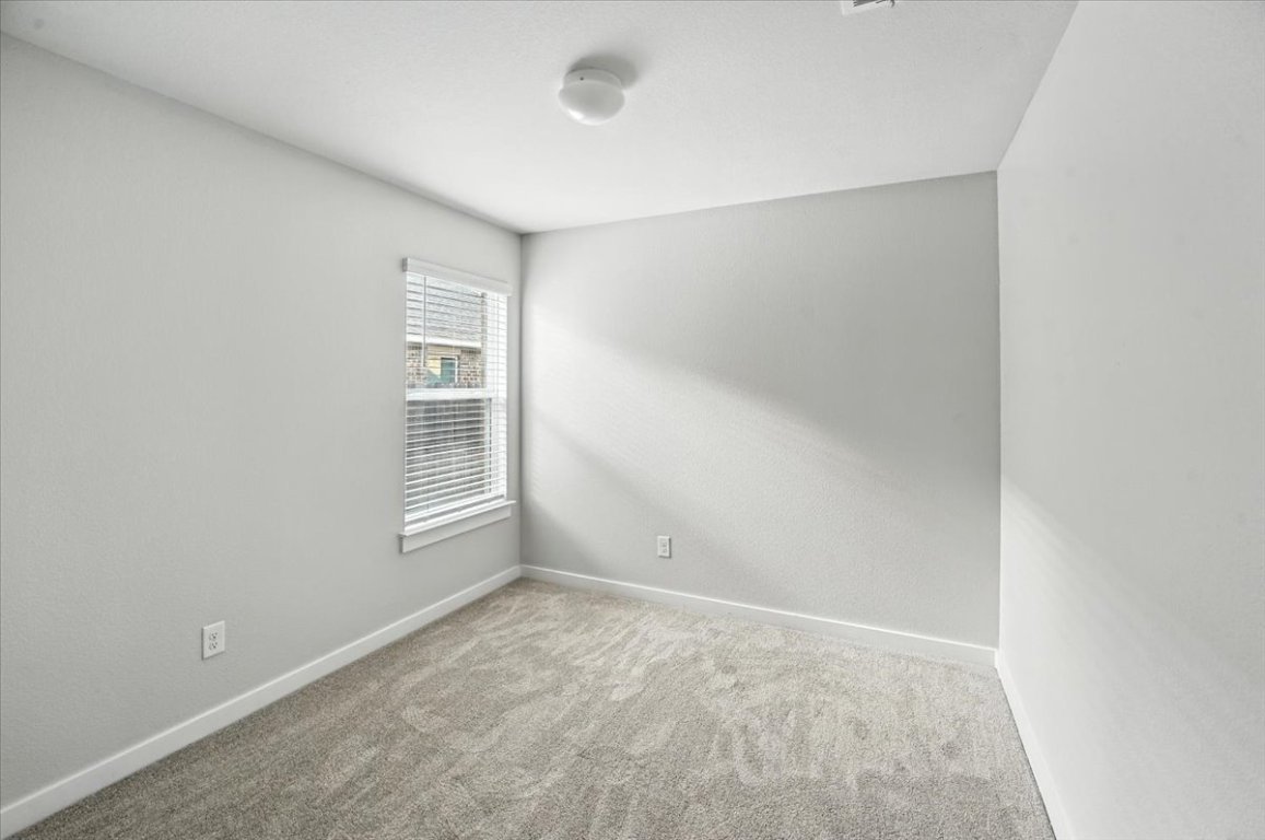 305 Old Trinity Way Georgetown, TX 78628 - Photo 16 of 23 an empty room with windows
