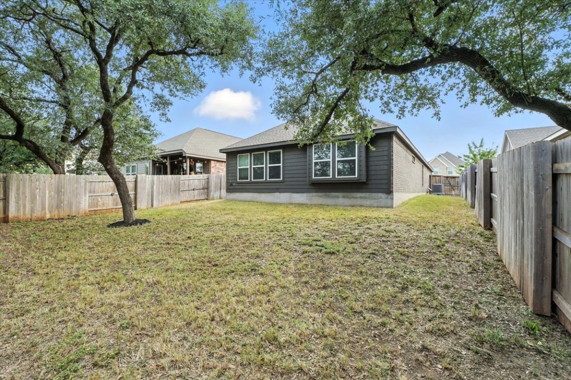 305 Old Trinity Way Georgetown, TX 78628 - Photo 21 of 23 a front view of a house with garden