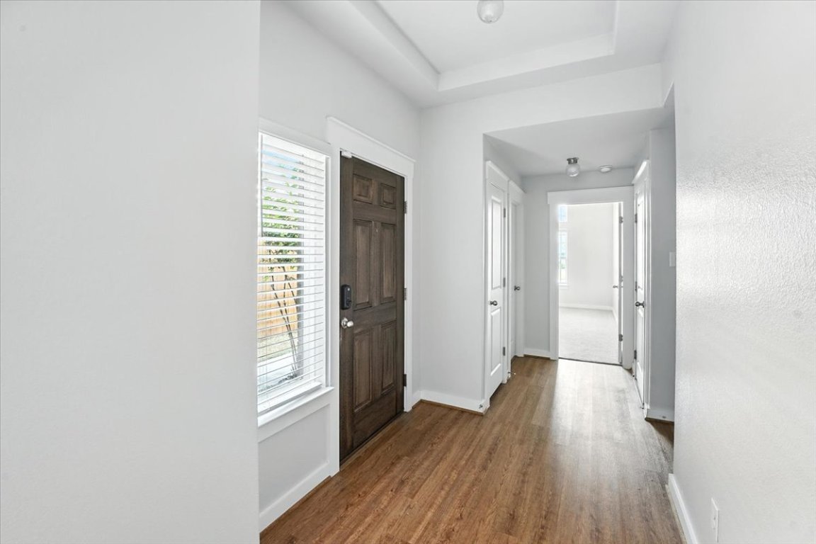 305 Old Trinity Way Georgetown, TX 78628 - Photo 5 of 23 a view of a hallway with wooden floor