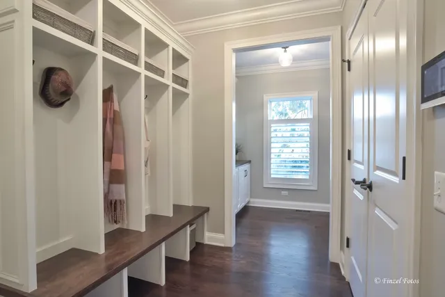 a view of hallway with livingroom and wooden floor