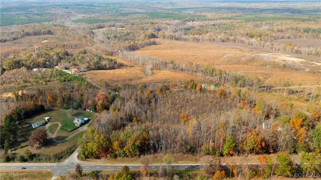 a view of lake with a couple of houses