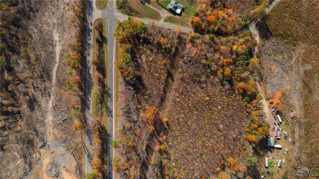 an aerial view of house with yard