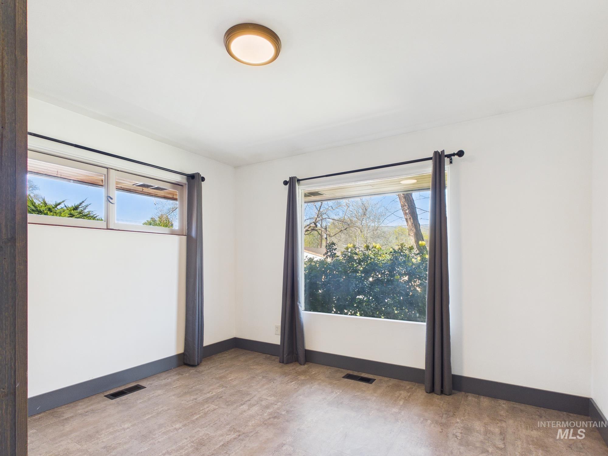 1156 14th Avenue Lewiston, ID 83501 - Photo 28 of 34 Spare room with baseboards and light wood-style flooring