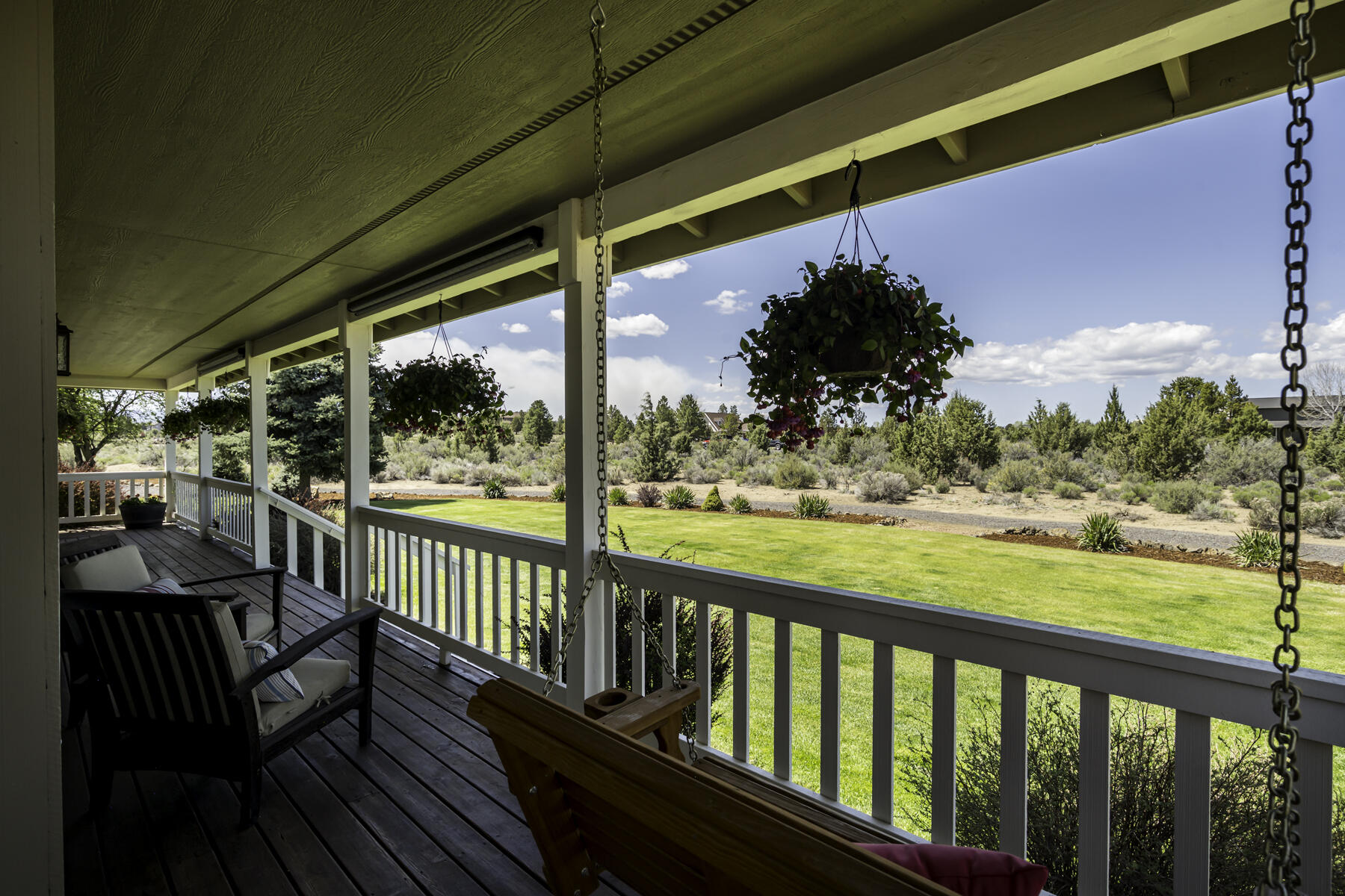 61030 Jennings Road Bend, OR 97702 - Photo 7 of 76 a view of balcony with couch and wooden floor