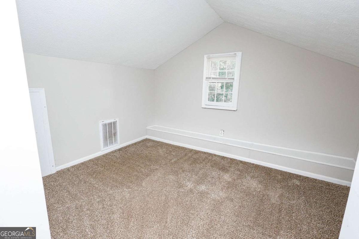 218 East Bonacre Road Cataula, GA 31804 - Photo 21 of 24 an empty room with a window